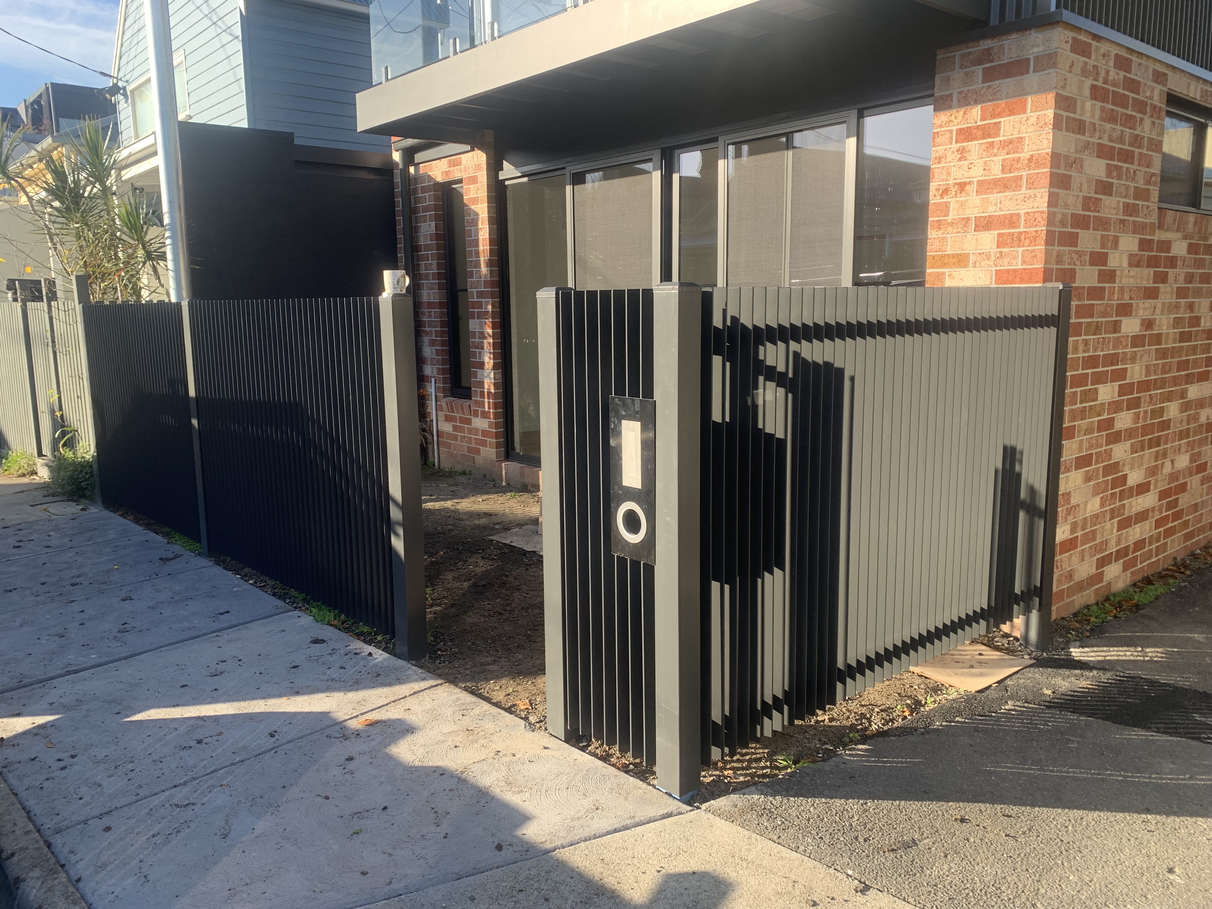 Modern aluminium slat front fence with intercom Doncaster